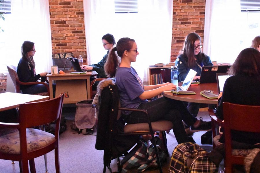 Madelyne Strauss and other students writing NaNoWriMo