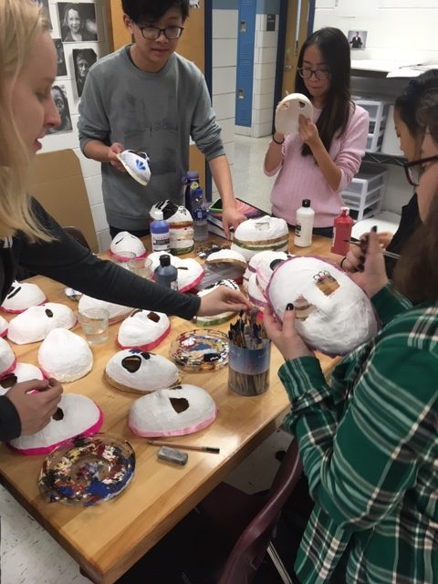 Decorating sugar skulls for the Day of the Dead. 