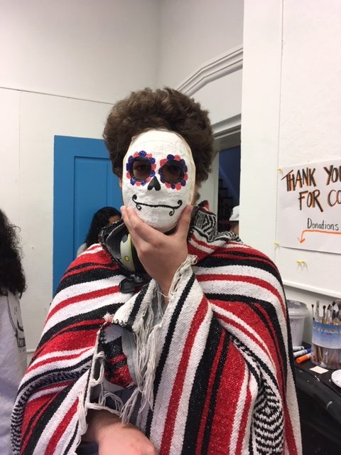 Showing off the sugar skulls for Day of the Dead. National Arts Society.
