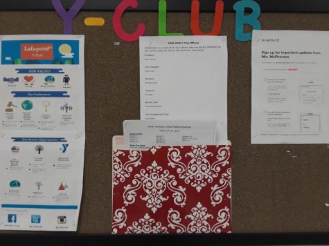 Y-Club bulletin board with announcements for the program.