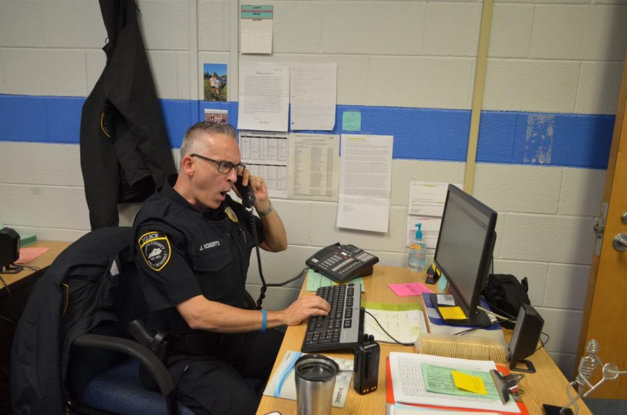 Officer Roberts working in his Office