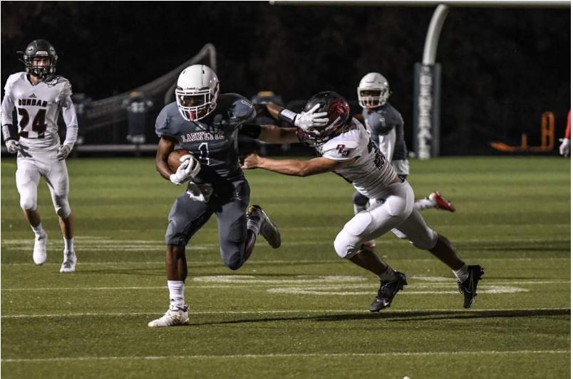 LEXINGTON, KY: Returner Trey Wilson III returns a punt to midfield.