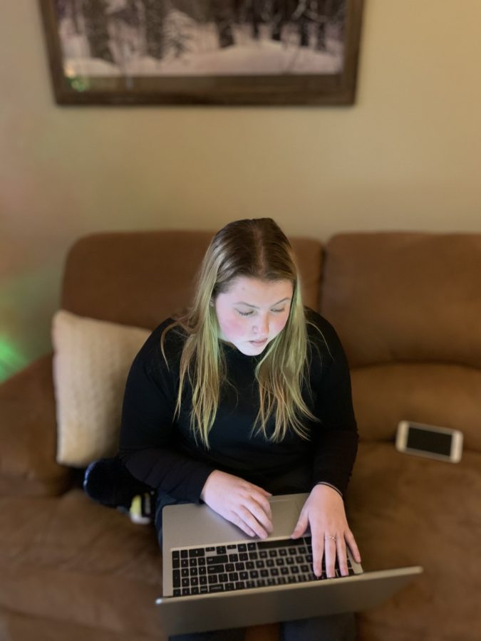 Lexington, Ky: A Kennedy Olsen, a Lafayette junior, uses technology to donate to a local charity.