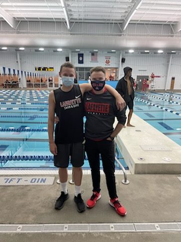 Former head coach James Washbish (right) and Nathan Vittitoe at a meet in 2020.