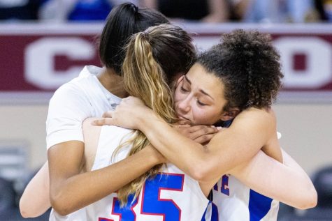 [RICHMOND, KY] Lafayettes Anaya Brown, left, Olivia Cathers, center, and Savannah Simpson, right, hug each other after the Lafayette vs. Franklin County 11th Region high school girls basketball championship game on Saturday, March 5, 2022, at McBrayer Arena at Eastern Kentucky University in Richmond, Kentucky. Franklin County won 41-29.