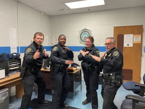 Officer Kiali Jelinek (center right) poses with her fellow Officers and Sargent, showing the team spirit she brings to the school.