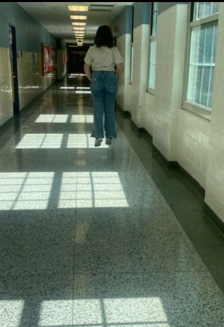 Lexington, KY. Meredith Kirby walking through the hallway on her way to class