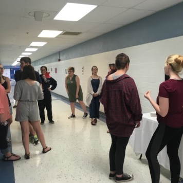 Lexington, KY: Members of the 22-23 National Art Honor Society at Lafayette meet in the hallway to discuss their next project.