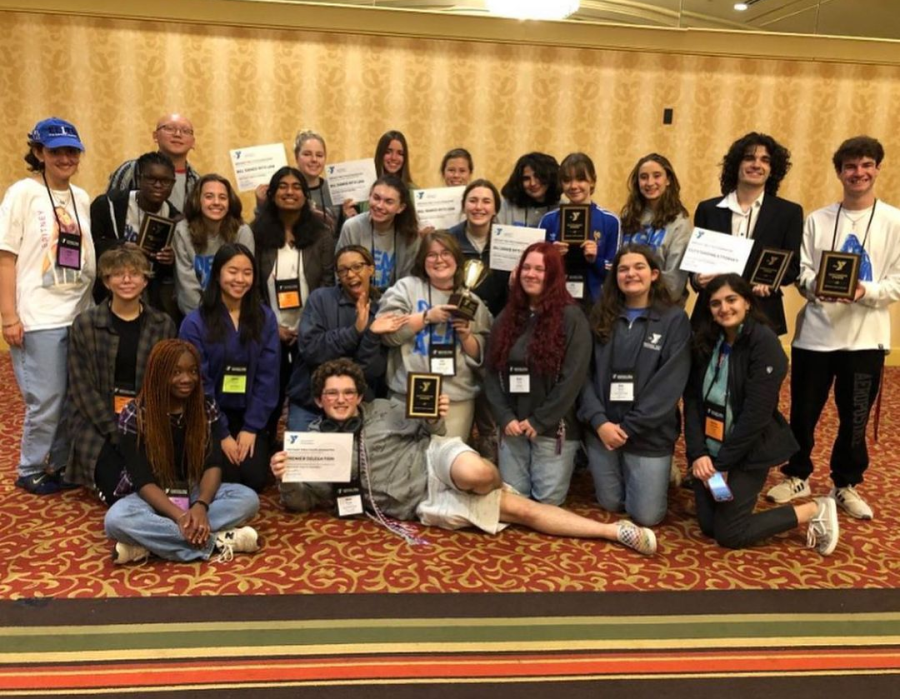 Y-club members holding the awards and certificates they received at the Kentucky Youth Assembly 2022.