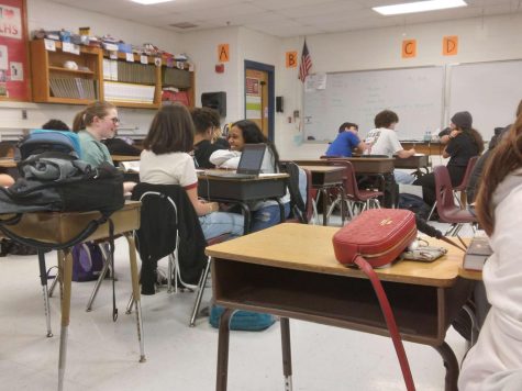 Lexington, KY: A Lafayette science classroom full of juniors and seniors working together on an assignment.