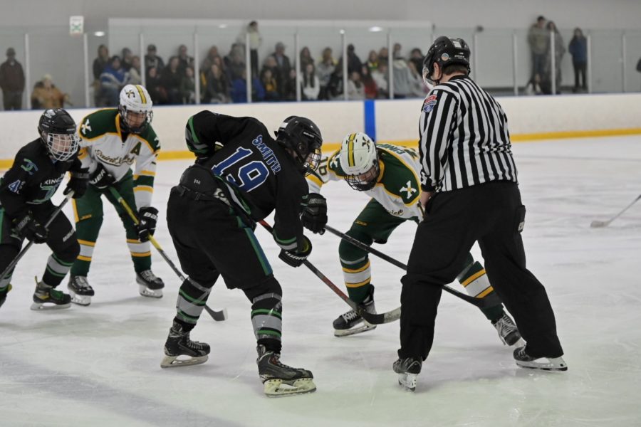 Ethan Smith (19) is facing off against the Saint Xavier Tigers.