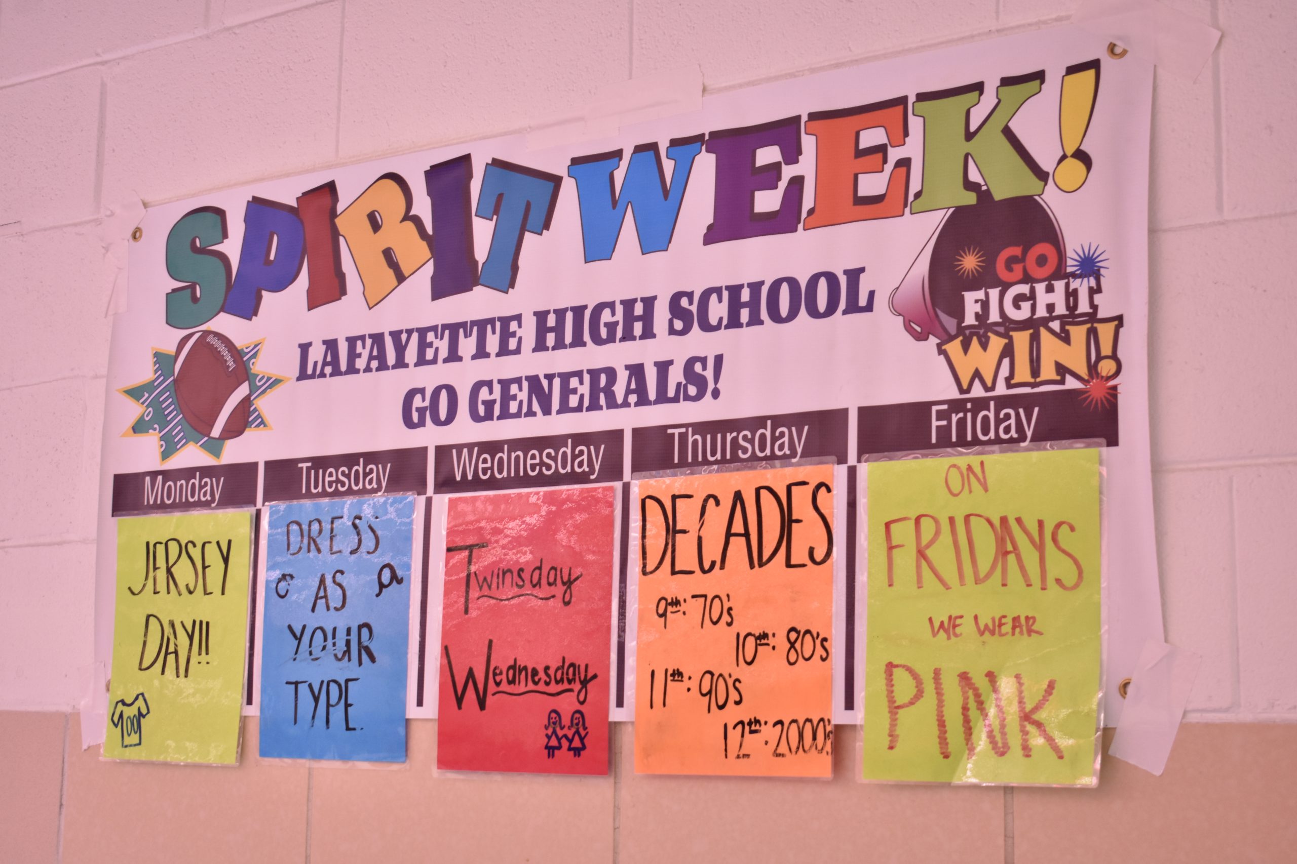 Photograph of Lafayette Homecoming spirit week poster, taken in LHS cafeteria.