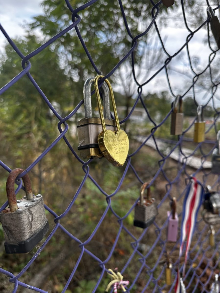 A+heart+shaped+lock+hung+up+on+a+purple+fence+for+Locks+for+Addiction+on+Newtown+Pike%2C+Lexington%2C+KY.+Photo+taken+on+Sunday%2C+October+9%2C+2023.