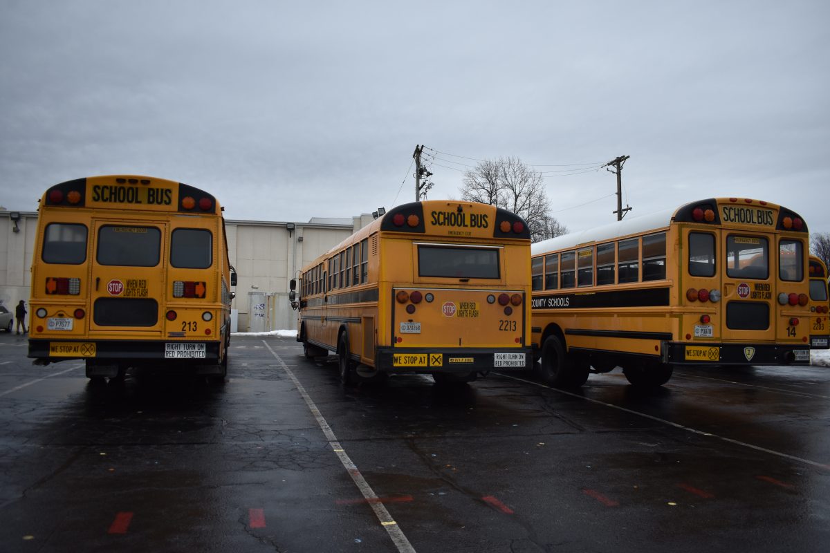 Buses getting ready to exit the band parking lot after school on 1/23/24.