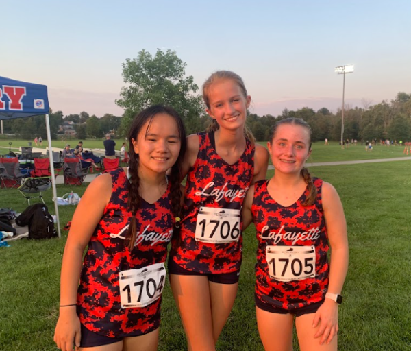 An image of Lafayette girls cross country runners, Sarah Boyd (Left), Ava Gentner (Middle), and Katelyn Conrad (Right) at a cross country meet during the 2023 season.  August 19, 2023.