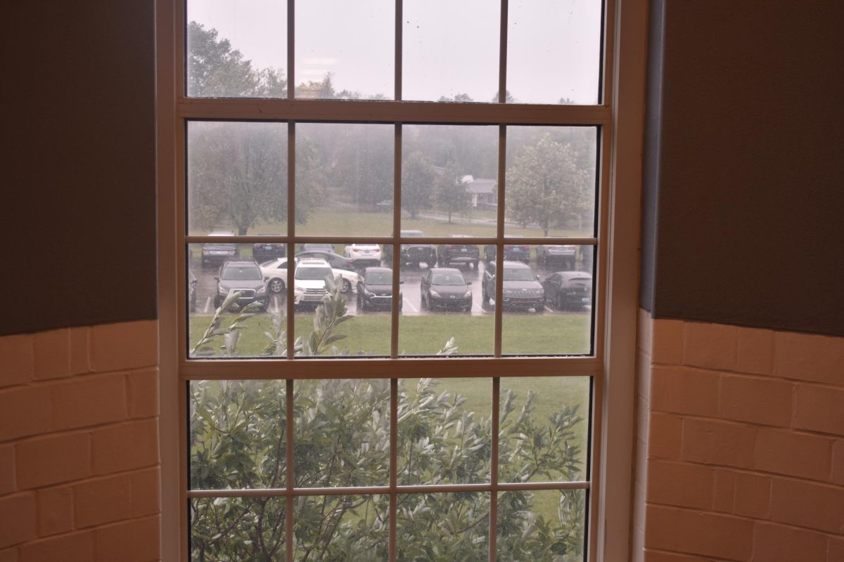 A photo taken on September 27, 2024 from a Lafayette stairwell, of the foggy, rainy weather caused by Hurricane Helene. This photo shows parents lining up to pick up students. 