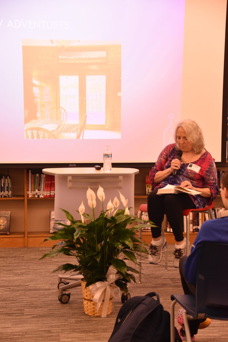 Ellen Hopkins reading her newest book "Sync" for a group of students in the library on September 25th, 2024.