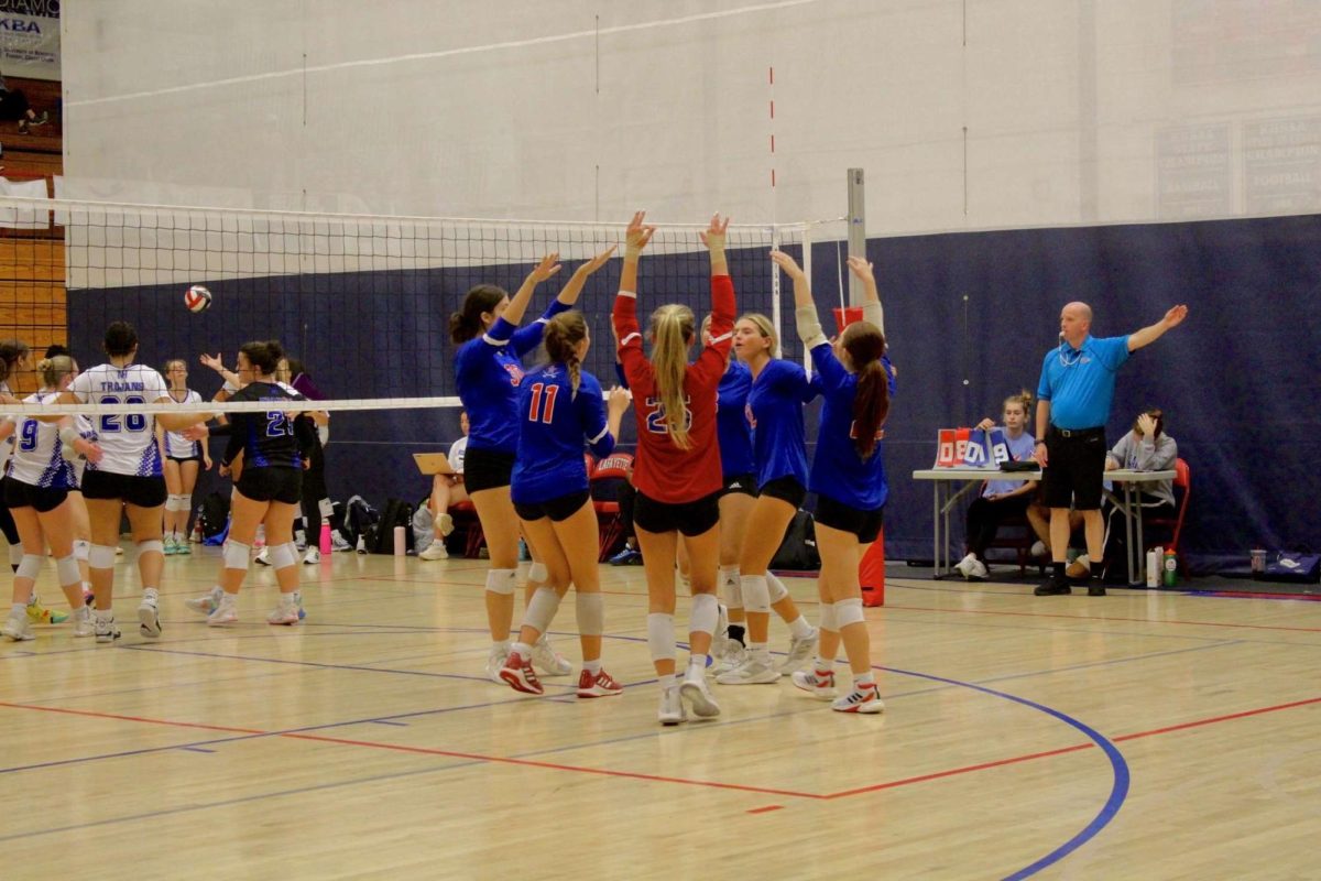 The Lafayette Volleyball team celebrating after winning a point at the Thoroughbred Smash. Taken at the Lafayette High School Gymnasium on September 20, 2024.