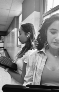 Students Freyja Knudsen and Brinley Hogue both study at Lafayette High School on Monday, Sept, 23.  Freyja is listening to music with her Airpods while Brinley is not.