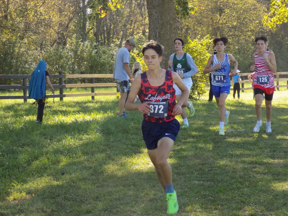 Sophomore Ben Choate eyeing the finish line in the boy's race. Taken October 20th. 2024.