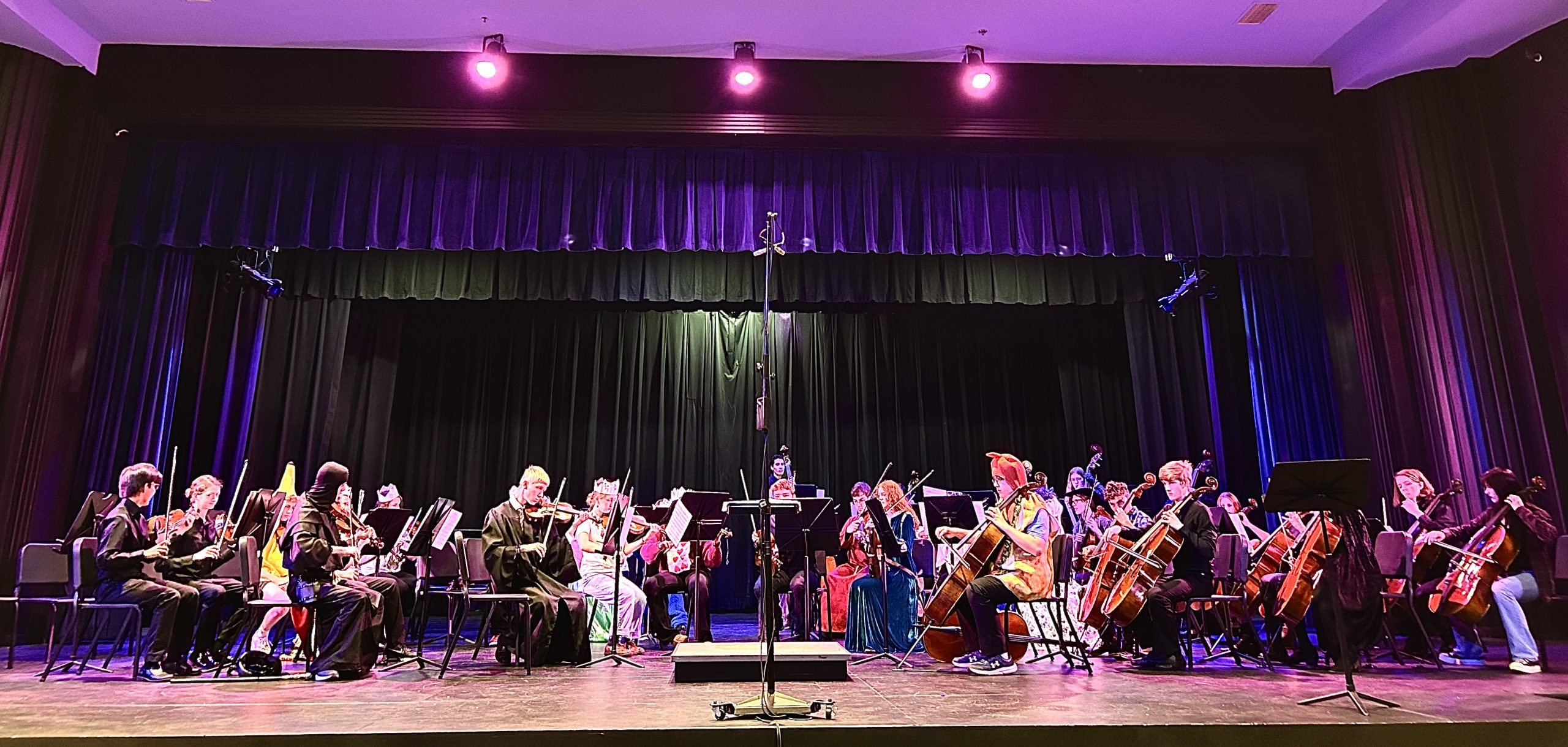 The Lafayette Symphonic Orchestra gets warmed up for their Costume Concert on September 25 in Beeler auditorium at Lafayette High School.