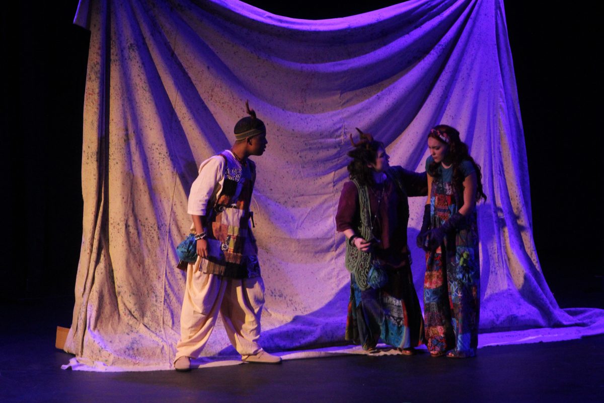 Lily and her mom talking to a guard in the Lily Plants A Garden Fall Show onstage at Lafayette High School on September 20th, 2024.