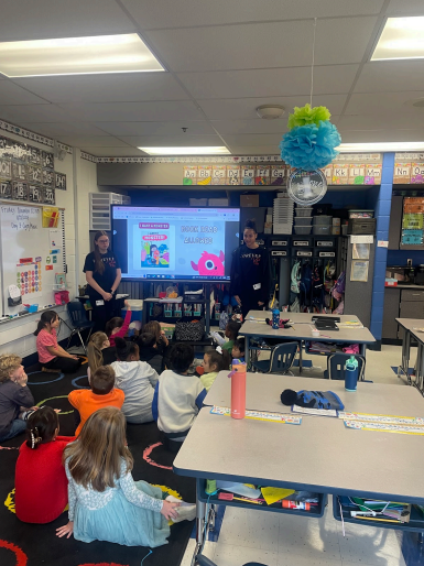 FCCLA members Deleigha Cummins and Marisa Presley visited the first grade students at Stonewall Elementary School for their community service project. 