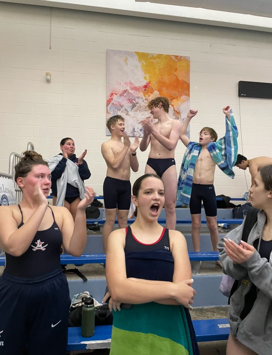 The Lafayette High School Swim team cheers for their teammates at the Lafayette vs. Anderson Country and Woodford Country Swim meet at 6:40 P.M. on November 20th.