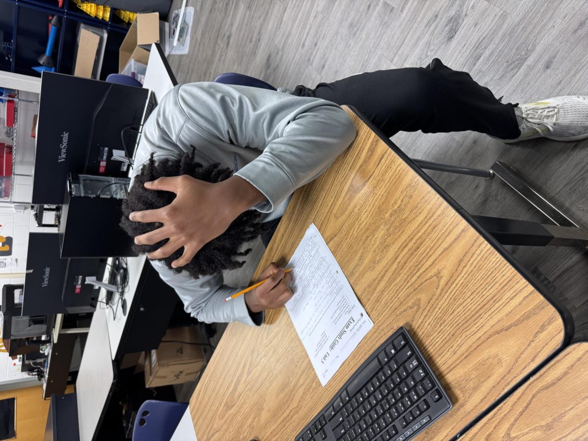 Jehovanis Kondo in Mr. Hackman's room getting help with homework after school at 3:45pm on November 26th, 2024