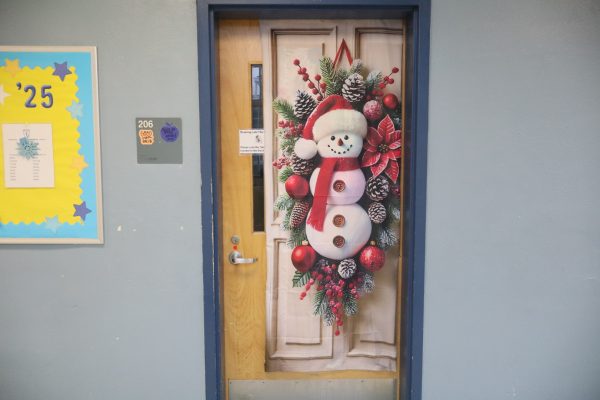 A snowman tapestry hung on room 206's door on December 10, 2024.