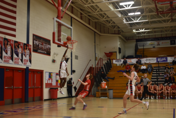 KJ Jones (#1) does a layup, getting more points for his team. Taken Monday, Feb. 10th, 2025.