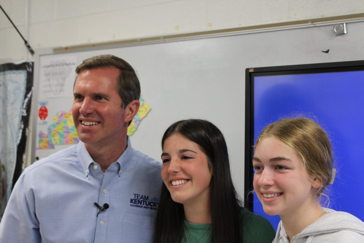 Governor Andy Beshear taking a picture with students during a surprise visit at Lafayette High School.