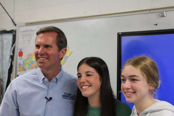 Governor Andy Beshear taking a picture with students during a surprise visit at Lafayette High School.