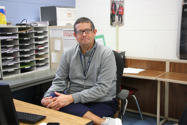 Coach Lawson posing for a picture after an interview in his health classroom 134. Taken on Nov 24, 2025.