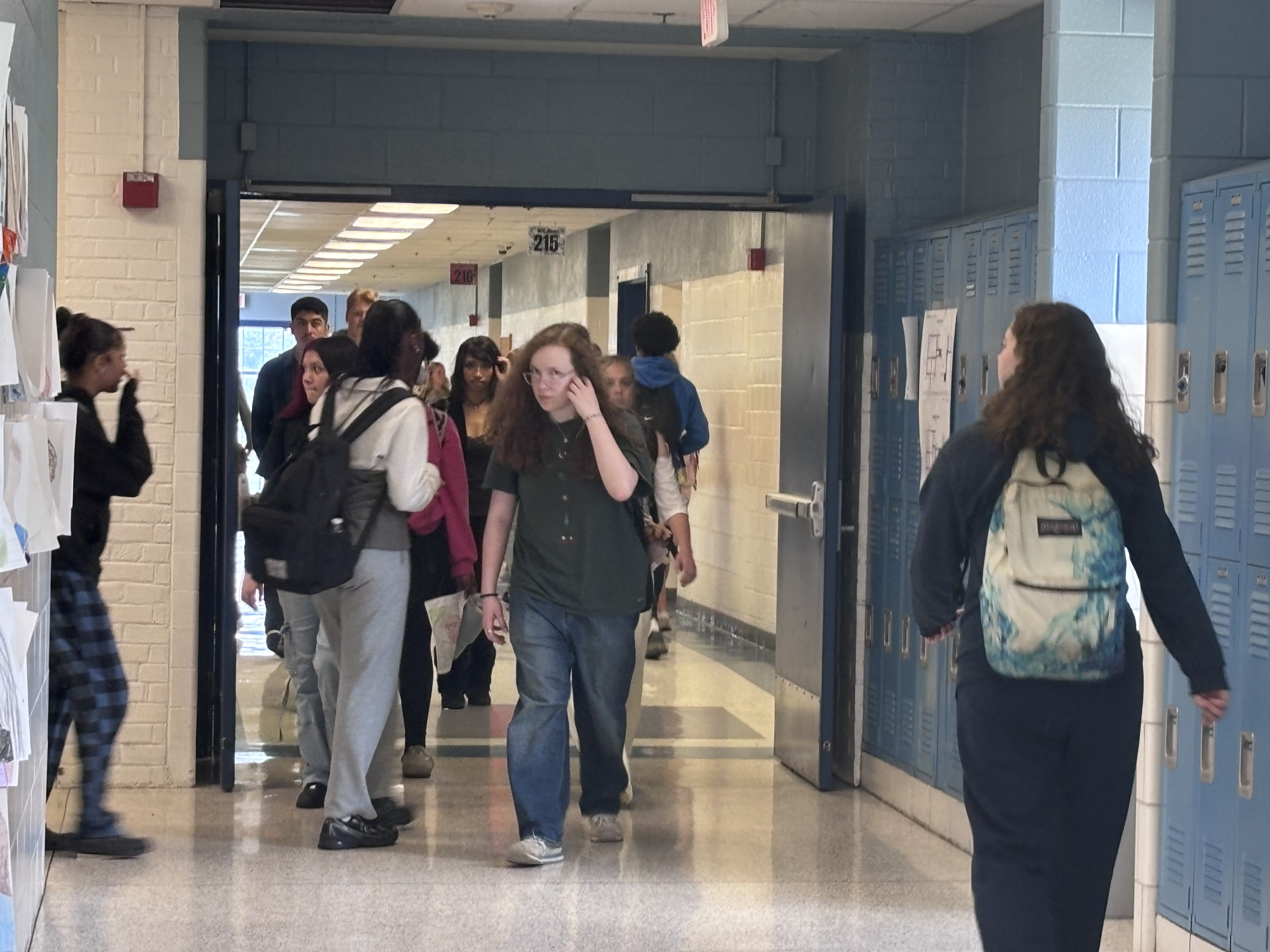 A cross-hall during the passing period on May 27th, 2026, to show that students are pushing through their last few days of school.
