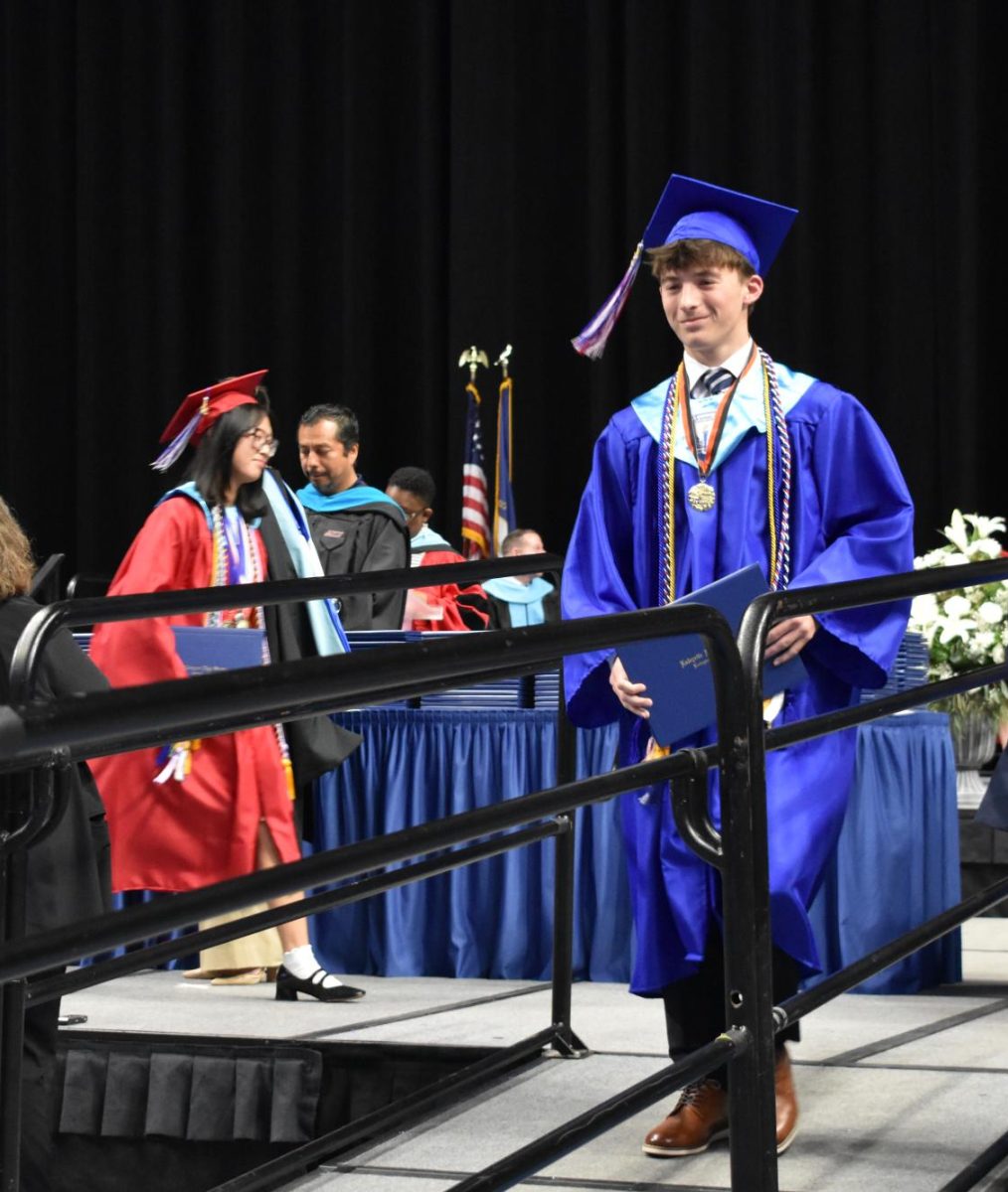 LEXINGTON, KY.  A graduate exits the stage, with diploma, at Lafayette's graduation ceremonies at Rupp Arena on June 4, 2026.