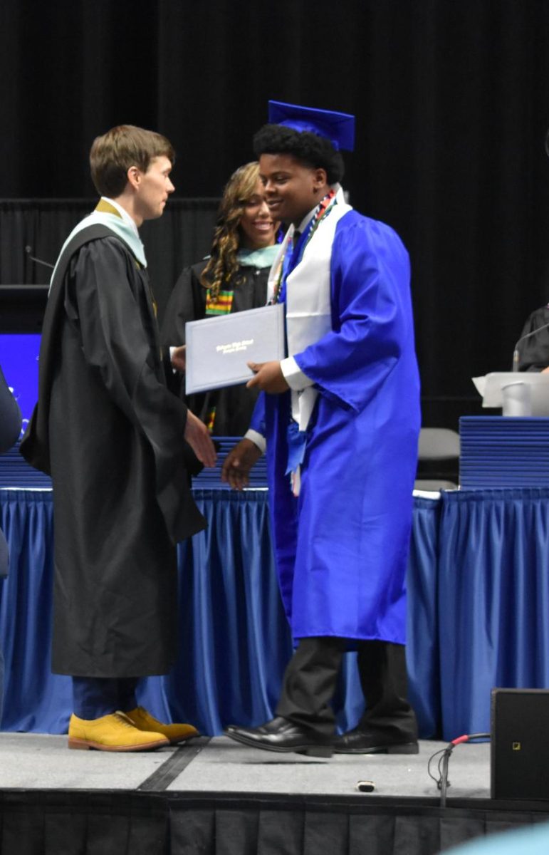 LEXINGTON, KY.  A graduate exits the stage, with diploma, at Lafayette's graduation ceremonies at Rupp Arena on June 4, 2026.