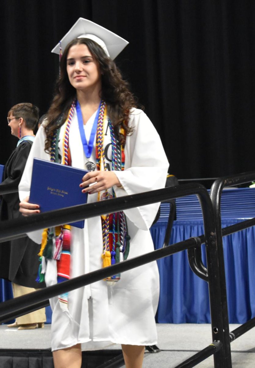 LEXINGTON, KY.  A graduate exits the stage, with diploma, at Lafayette's graduation ceremonies at Rupp Arena on June 4, 2026.