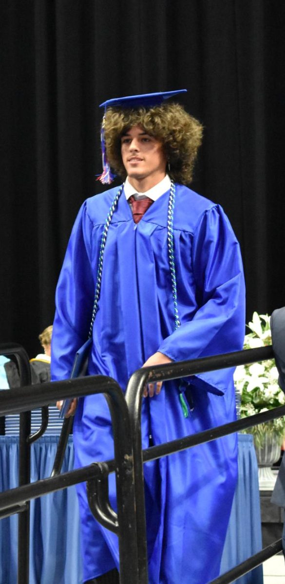 LEXINGTON, KY.  A graduate exits the stage, with diploma, at Lafayette's graduation ceremonies at Rupp Arena on June 4, 2026.