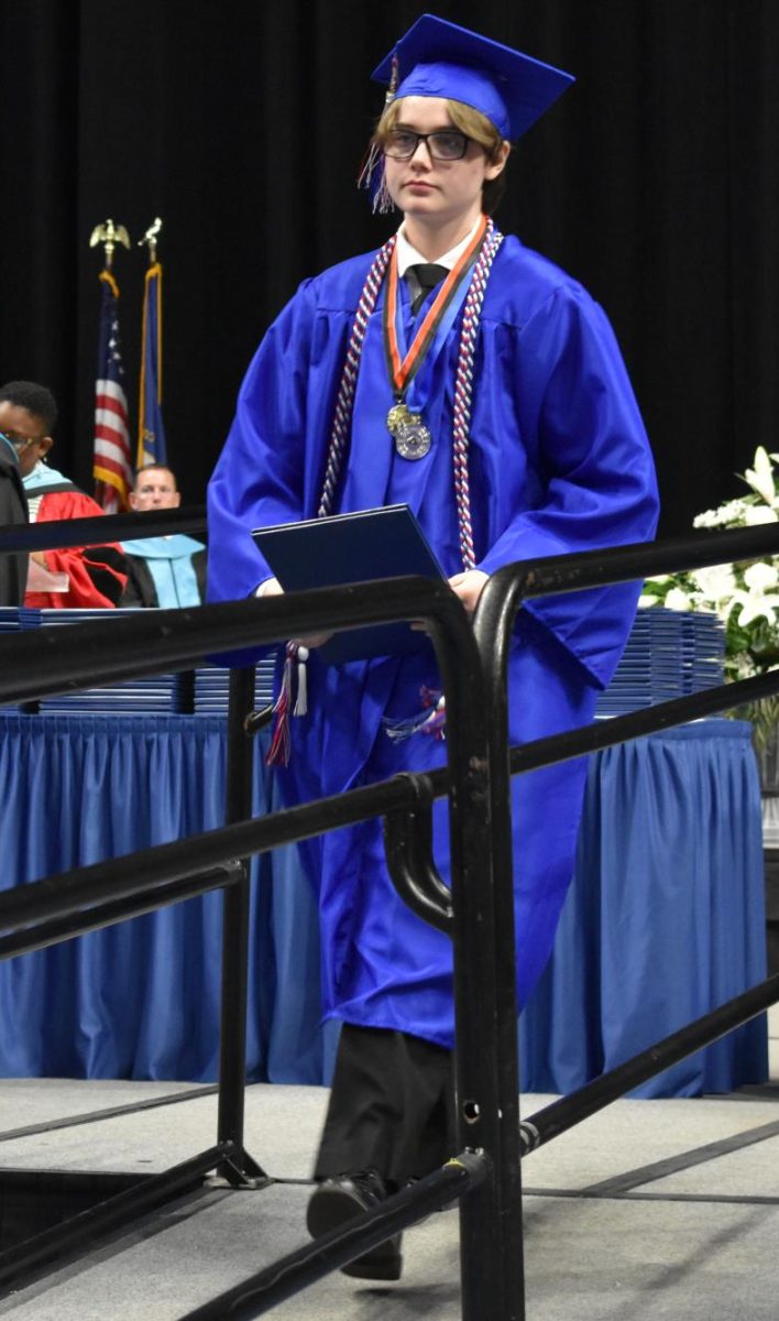 LEXINGTON, KY.  A graduate exits the stage, with diploma, at Lafayette's graduation ceremonies at Rupp Arena on June 4, 2026.