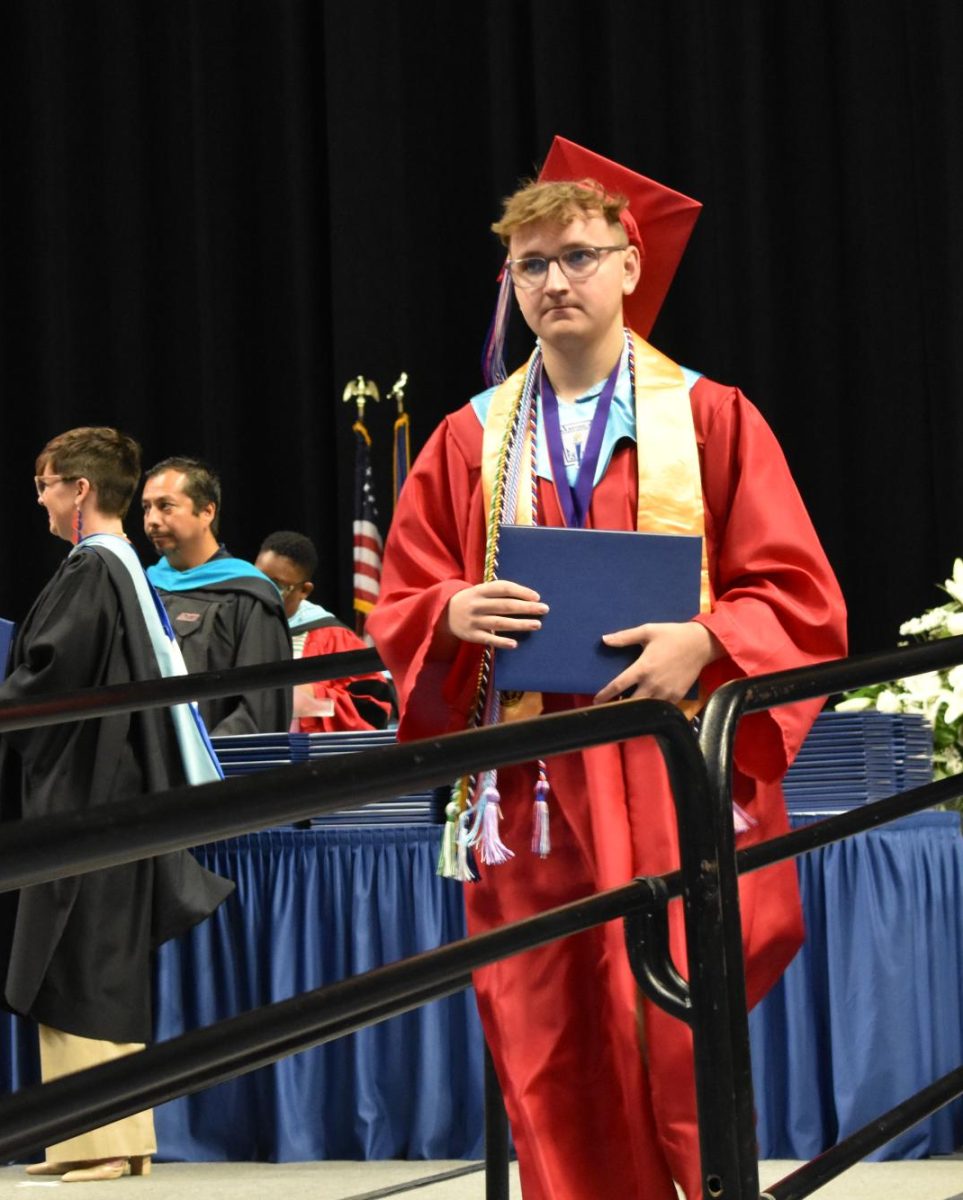 LEXINGTON, KY.  A graduate exits the stage, with diploma, at Lafayette's graduation ceremonies at Rupp Arena on June 4, 2026.