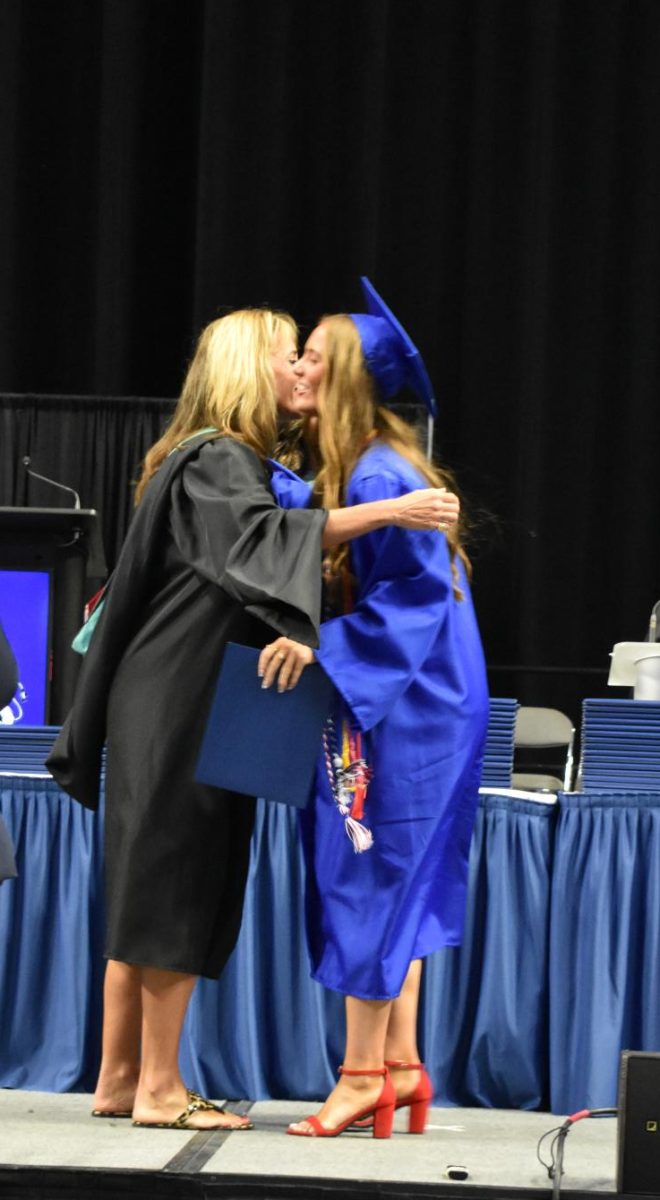 LEXINGTON, KY.  Alison Denton presents a diploma to her daughter at Lafayette's graduation ceremonies at Rupp Arena on June 4, 2026.