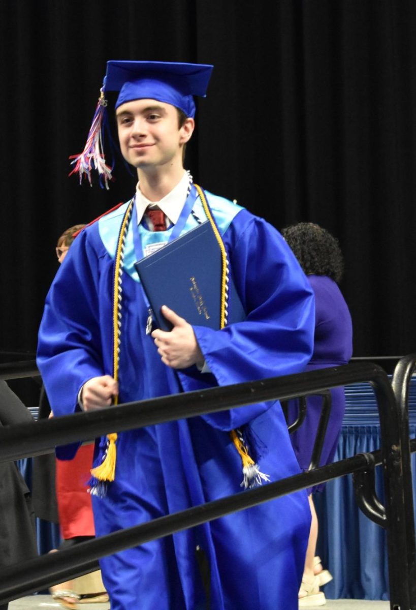 LEXINGTON, KY.  A graduate exits the stage, with diploma, at Lafayette's graduation ceremonies at Rupp Arena on June 4, 2026.