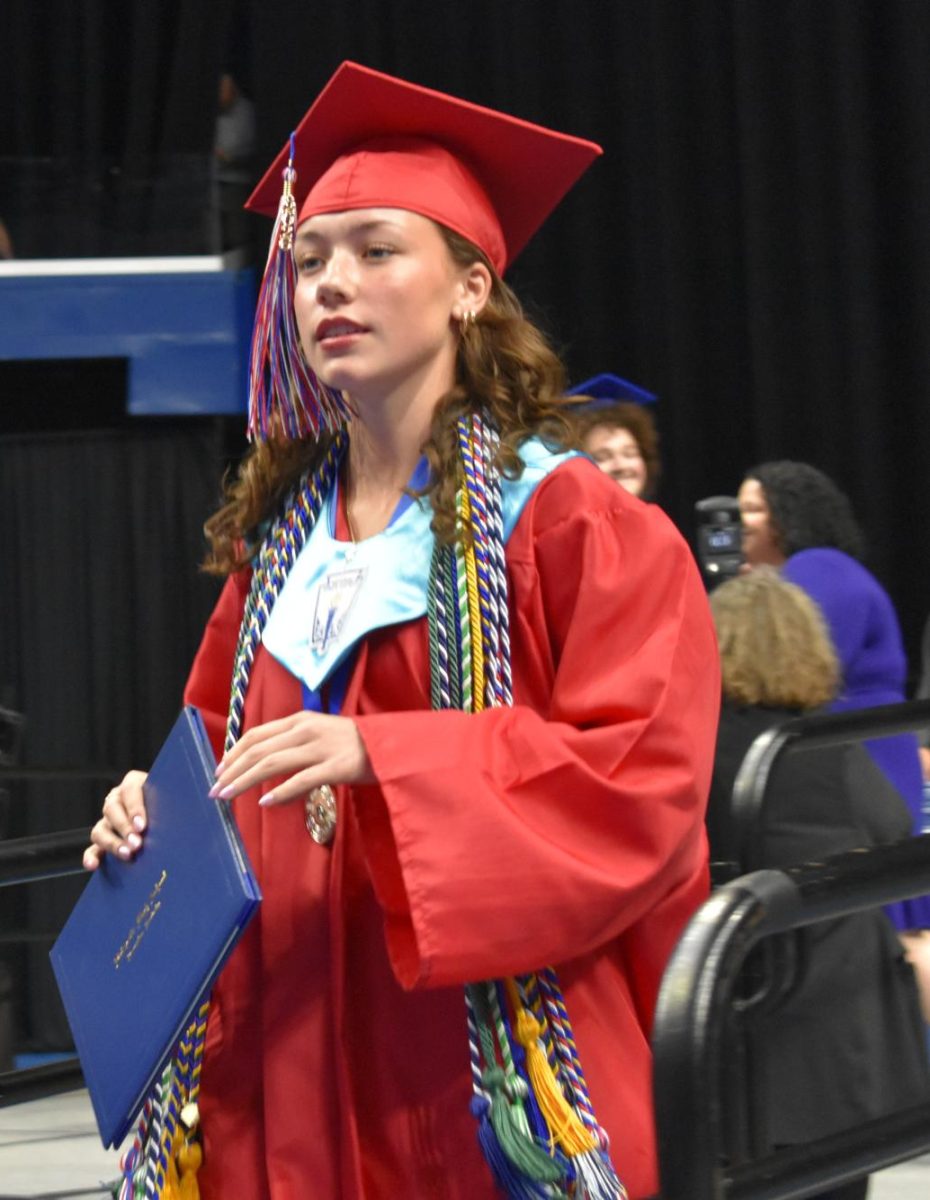 LEXINGTON, KY.  A Isabella Dietzel exits the stage, with diploma, at Lafayette's graduation ceremonies at Rupp Arena on June 4, 2026.