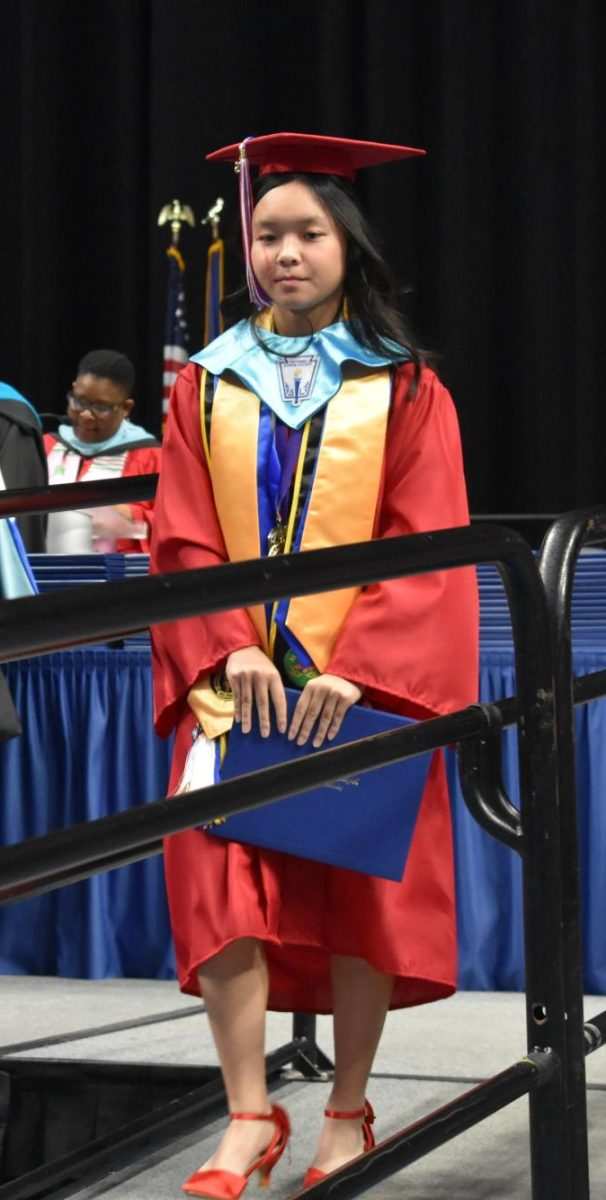LEXINGTON, KY.  A graduate exits the stage, with diploma, at Lafayette's graduation ceremonies at Rupp Arena on June 4, 2026.