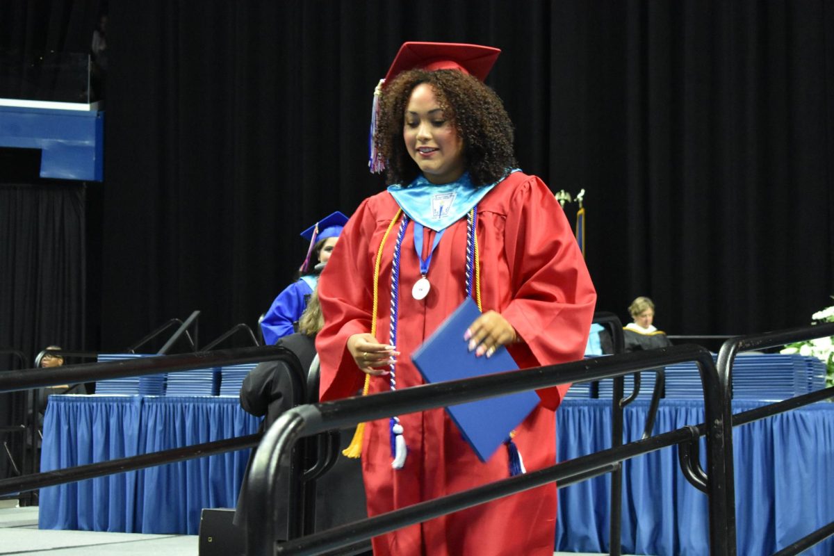 LEXINGTON, KY.  A graduate exits the stage, with diploma, at Lafayette's graduation ceremonies at Rupp Arena on June 4, 2026.