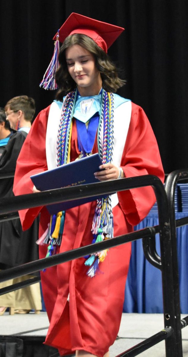 LEXINGTON, KY.  A graduate exits the stage, with diploma, at Lafayette's graduation ceremonies at Rupp Arena on June 4, 2026.