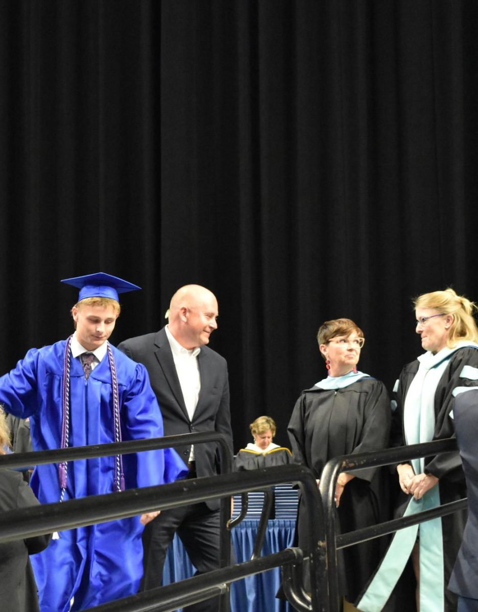 LEXINGTON, KY.  Staff members present diplomas to their children at Lafayette's graduation ceremonies at Rupp Arena on June 4, 2026.