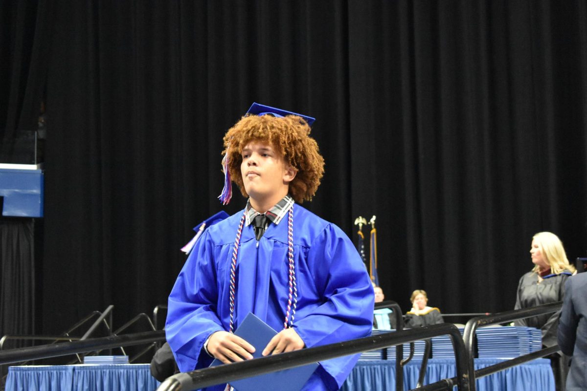 LEXINGTON, KY.  A graduate exits the stage with a diploma at Lafayette's graduation ceremonies at Rupp Arena on June 4, 2026.
