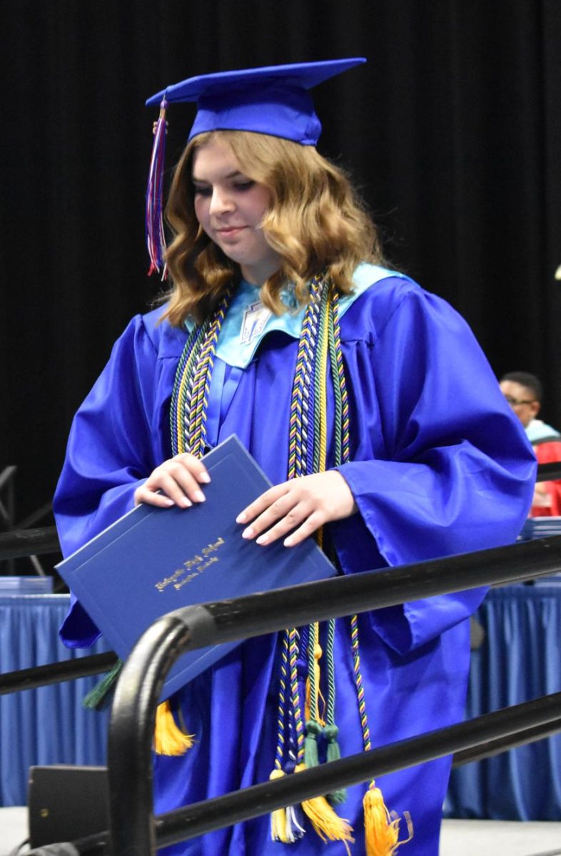 LEXINGTON, KY.  Alyssa Lucas exits the stage with a diploma at Lafayette's graduation ceremonies at Rupp Arena on June 4, 2026.
